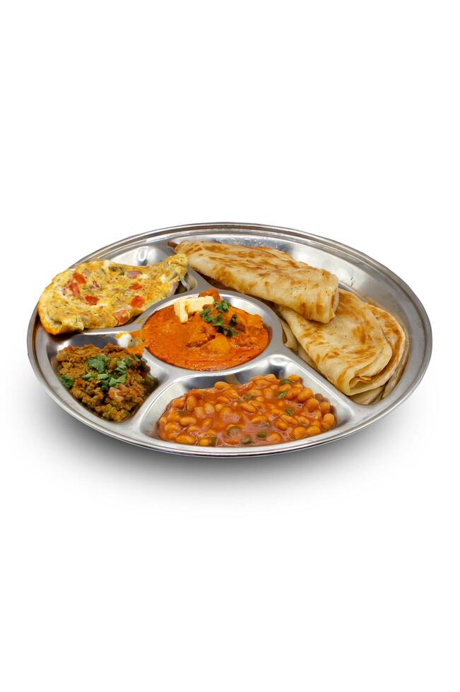 Indian Thali with Egg Omelette, Curry, Beans, Roti and Butter photo