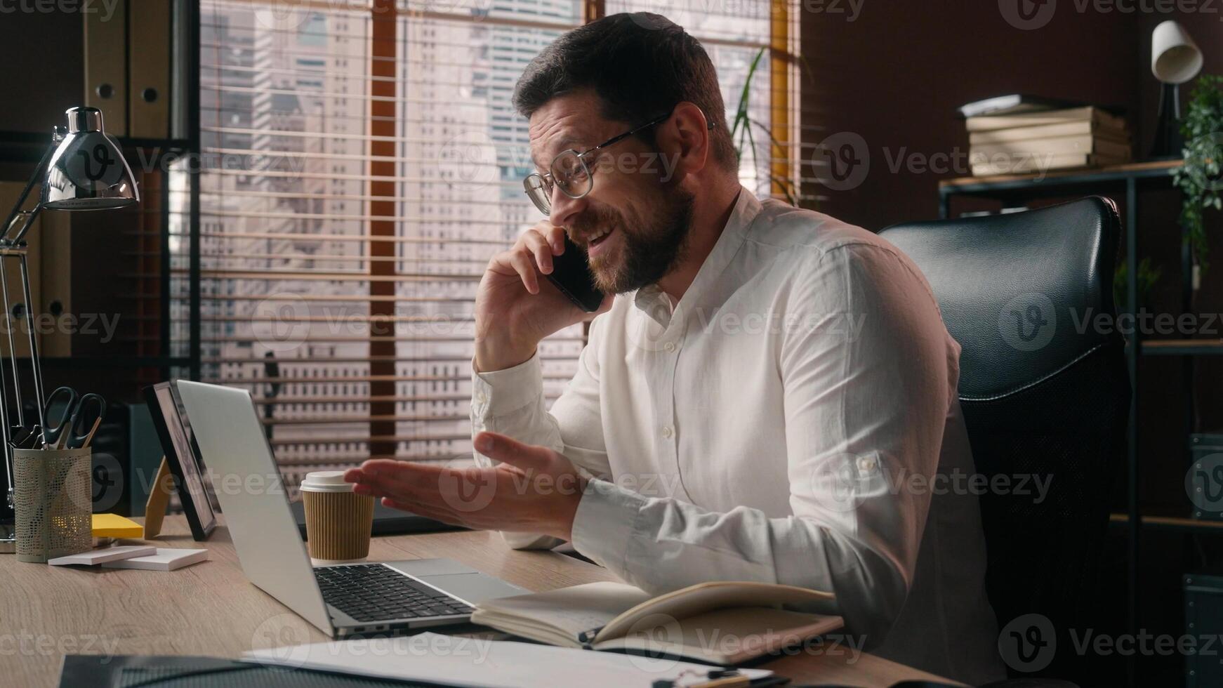 Busy Caucasian guy business man boss salesman male discussing startup mobile phone in office executive employer talking call gadget happy businessman showing ok approval symbol entrepreneur working photo