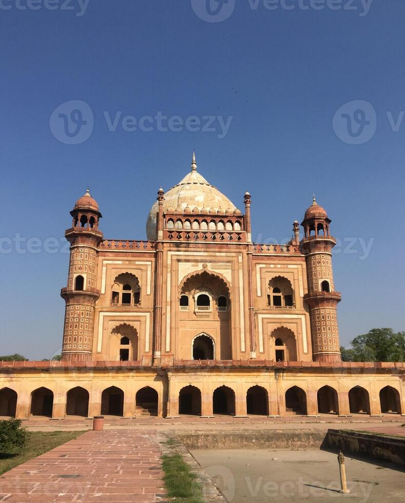 Safdarjung Tomb in Delhi, India. Mughal architecture under a clear blue sky. photo