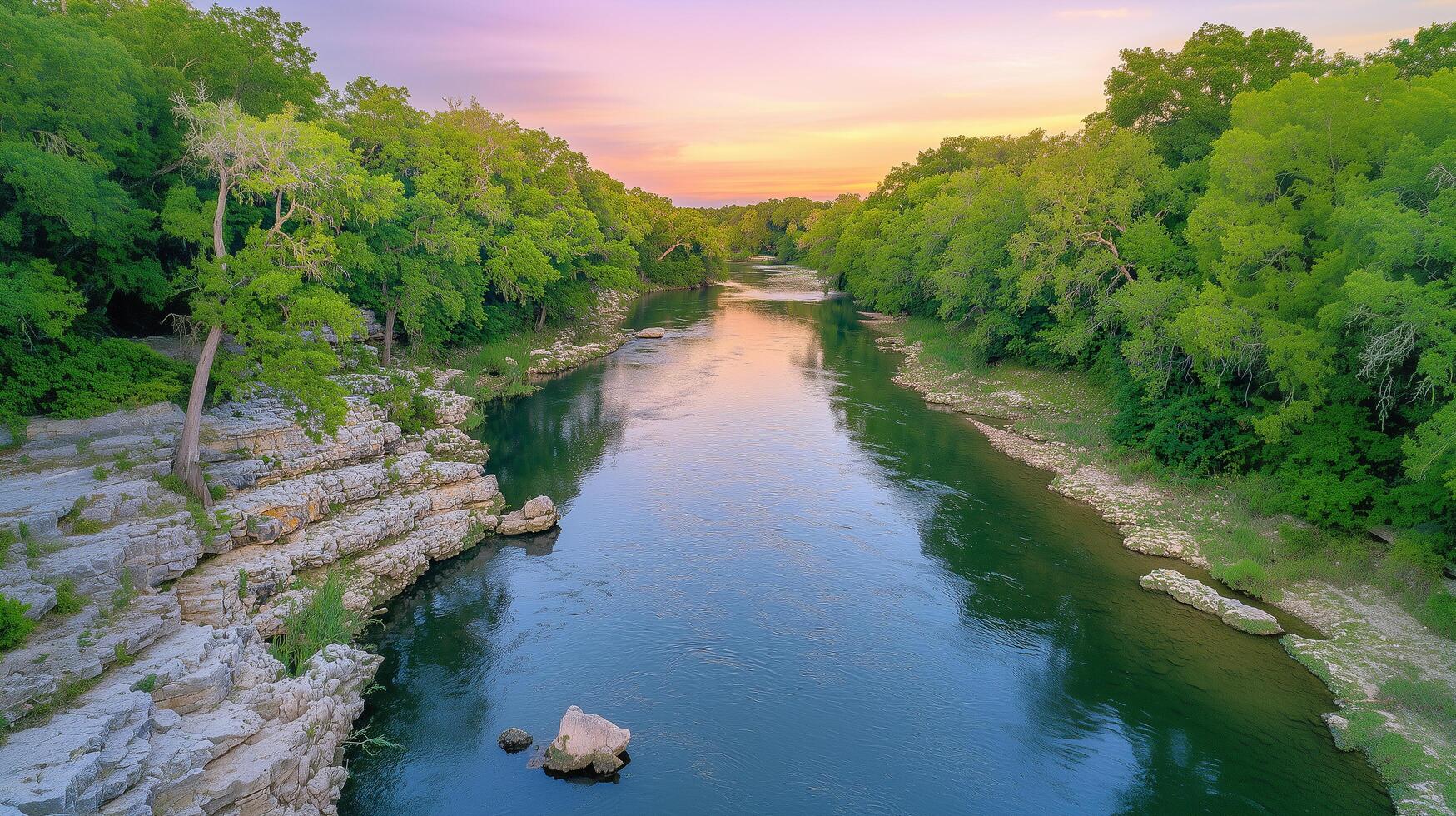 Calm River with Rocks and Green Trees at Twilight photo