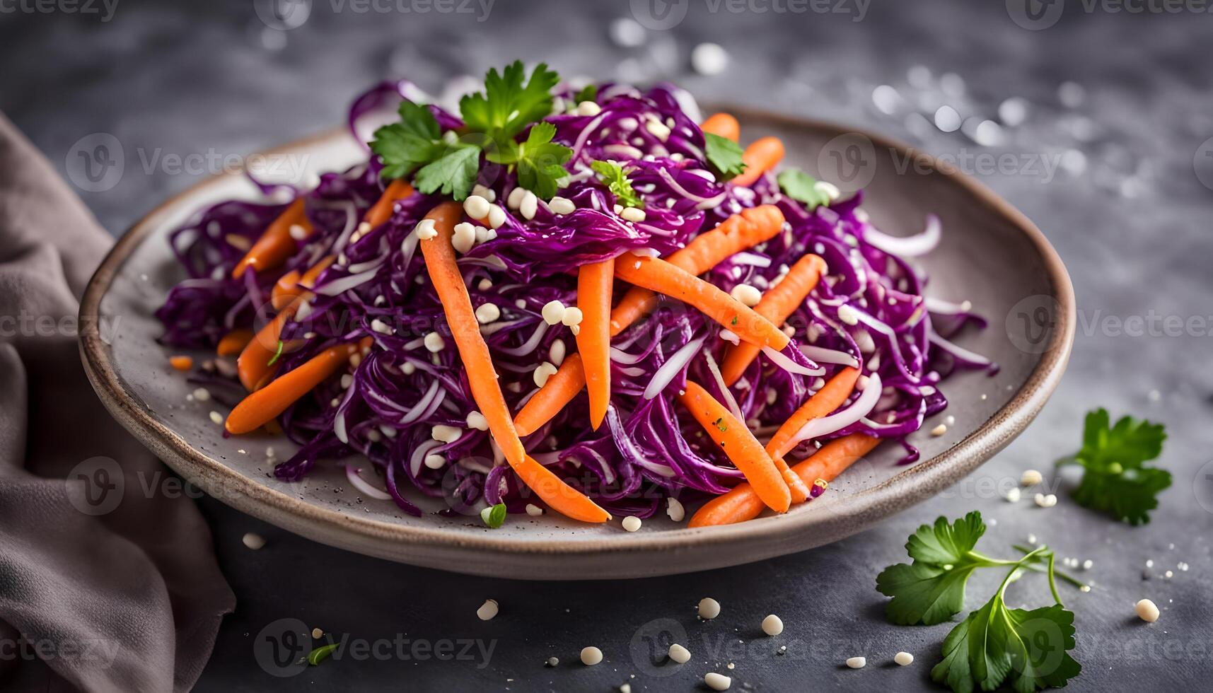 Red Cabbage and Carrot Slaw salad with cilantro and sesame seeds on stone background photo