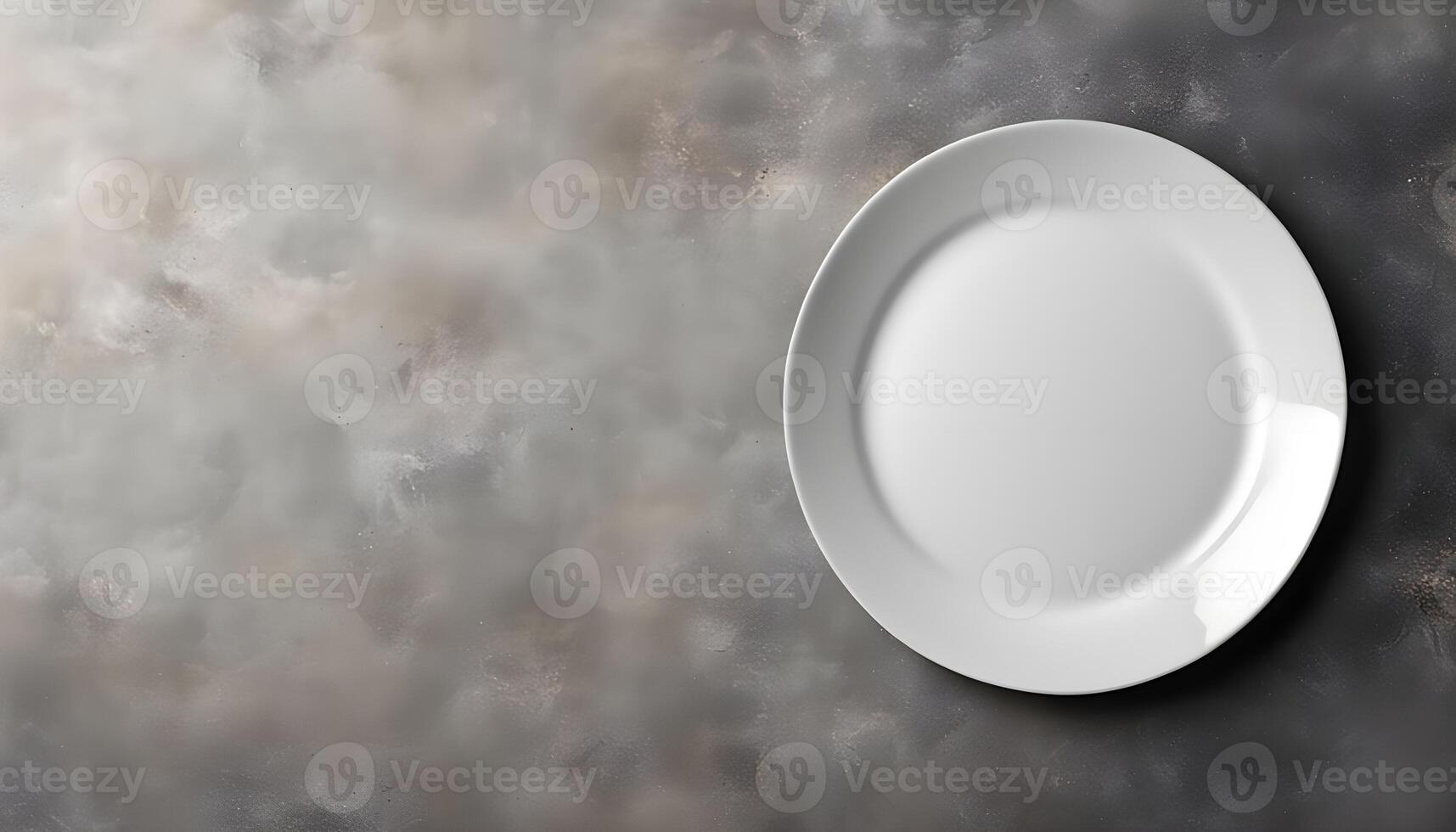 Empty plate on gray stone concrete background, top view with copy space photo