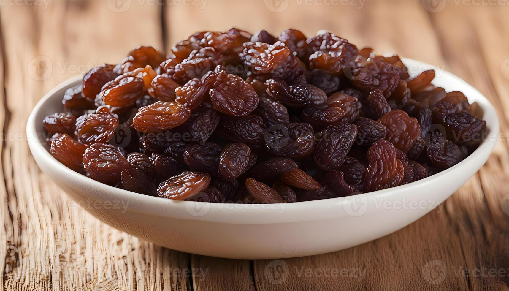 Organic Dried Brown Raisins in a Bowl photo