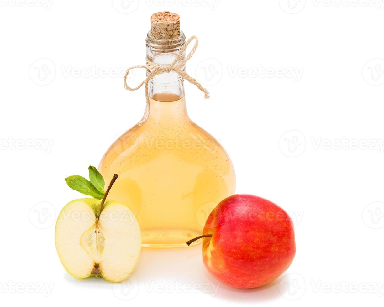 Homemade fermented apple vinegar isolated on white photo