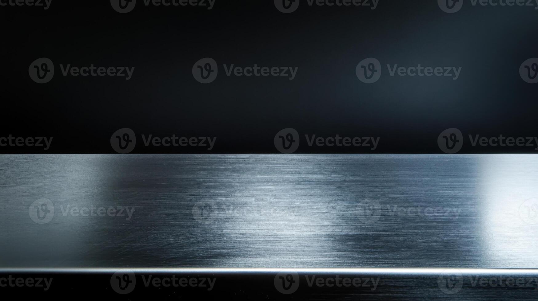 Minimalist metallic surface reflecting light with dark background photo