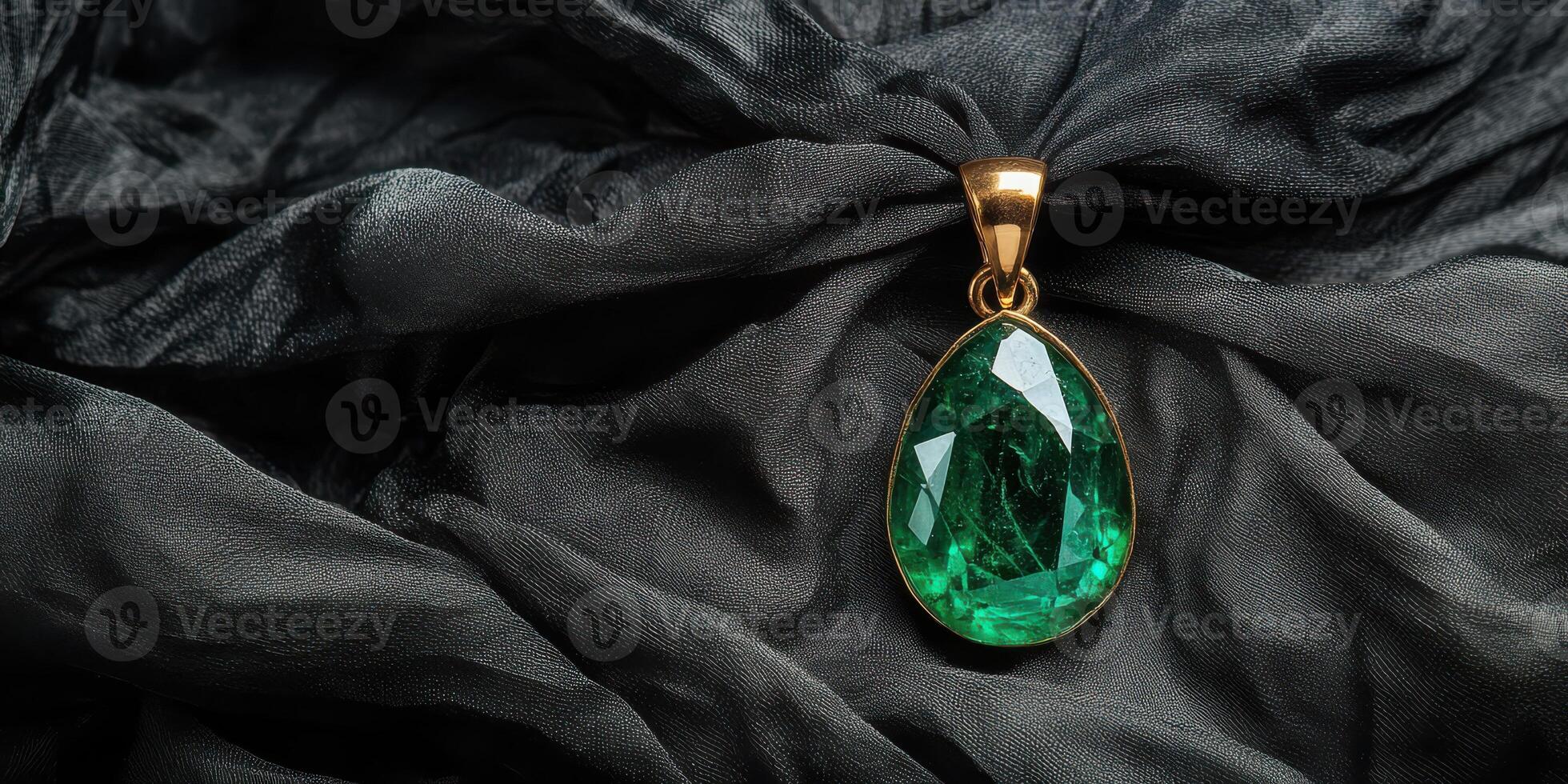 Elegant green gemstone pendant on luxurious dark fabric creating a rich aesthetic photo