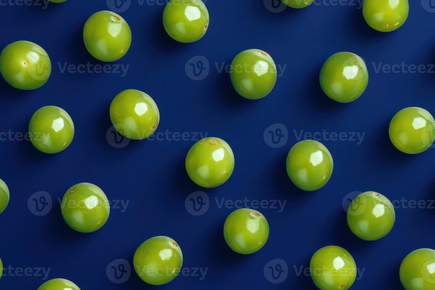 Pattern of fresh green grapes on a blue background for food and beverage concepts photo