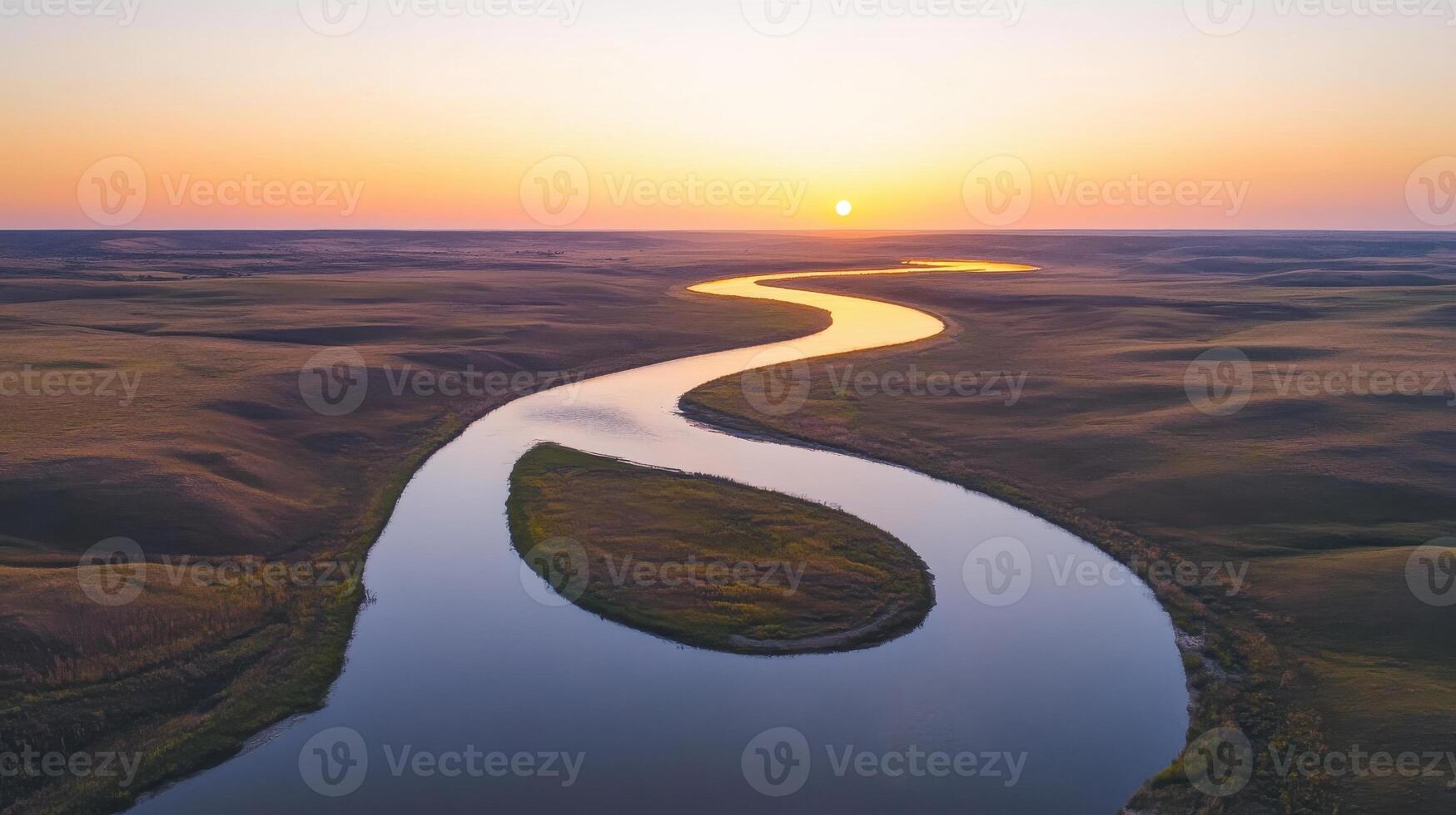 Serene sunset over meandering river and rolling hills landscape photo