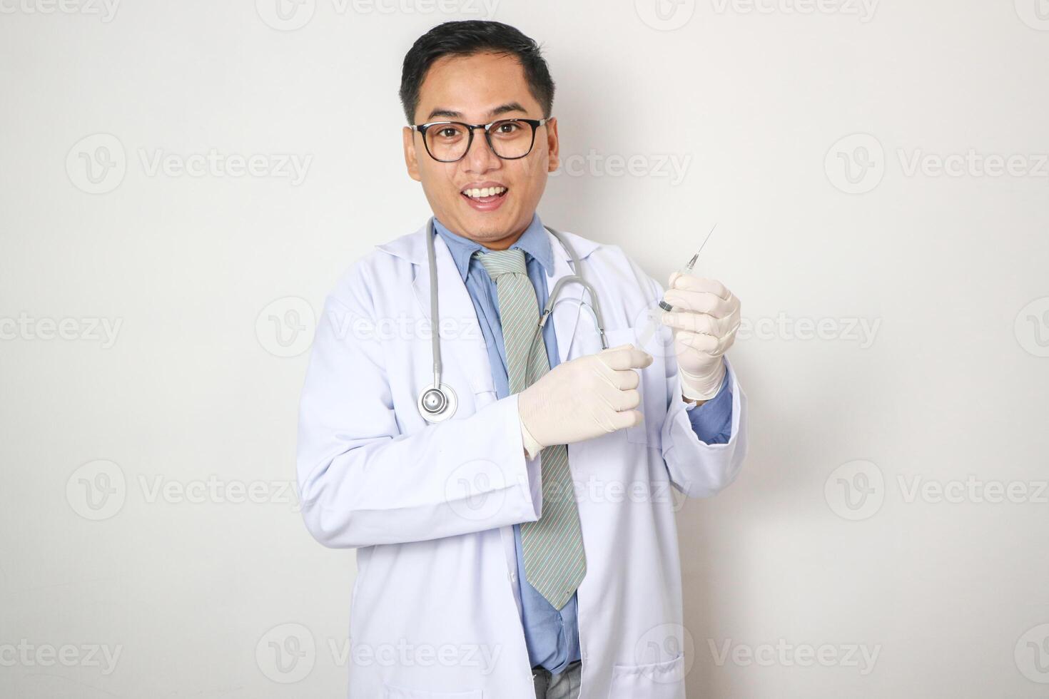 Portrait young asian doctor hold syringe needle insulin in room at hospital, medical and insurance concept. photo