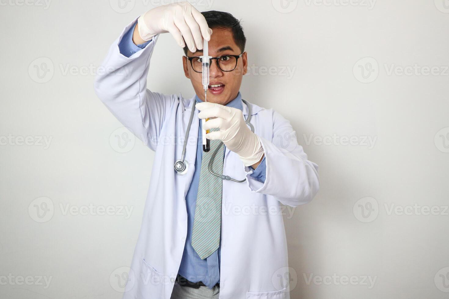 hands of a doctor taking samples of blood tubes for analysis lab technician drawing blood samples using a tube holder in the clinical laboratory photo