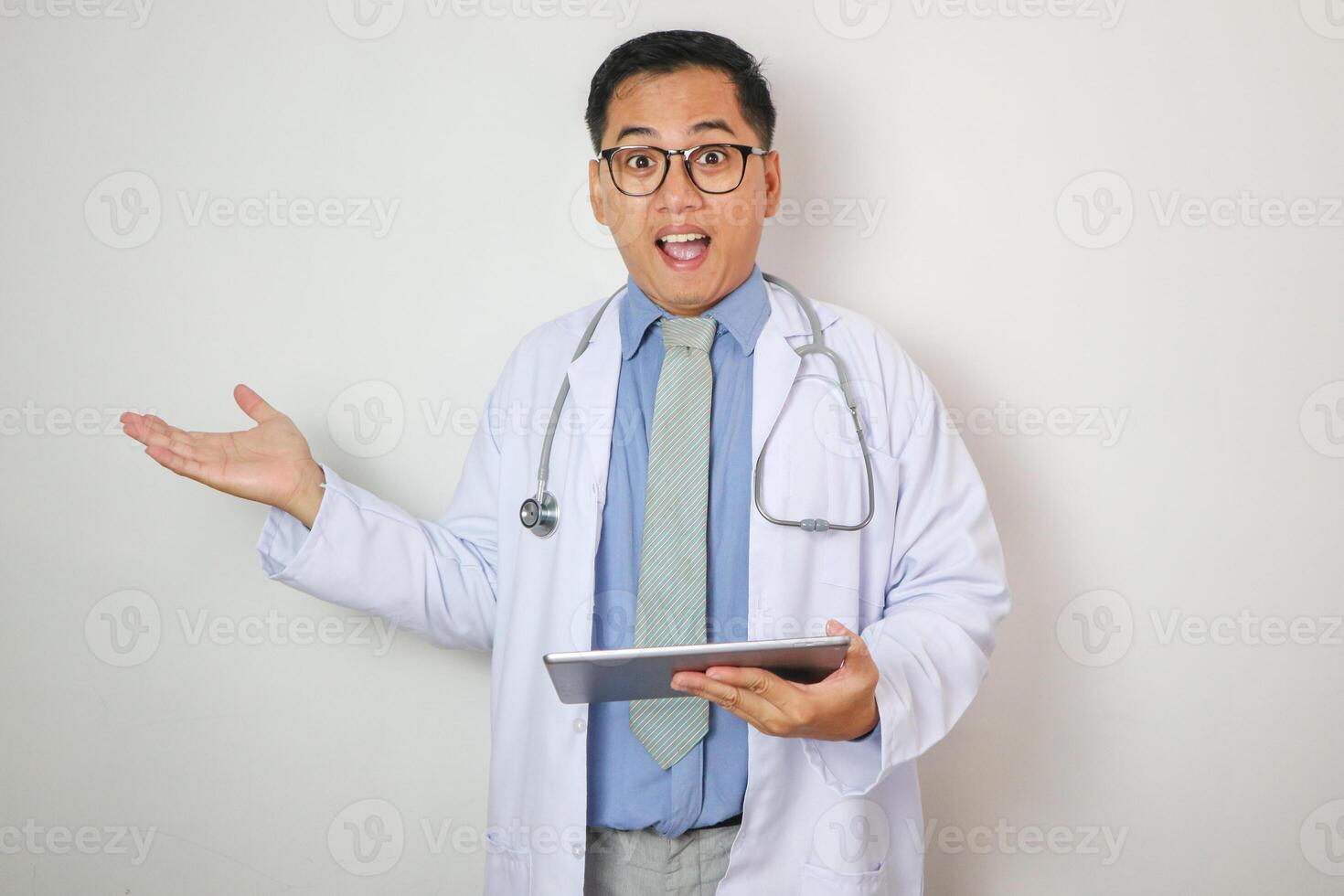 Asian doctor with tablet showing confused expression with hands open photo