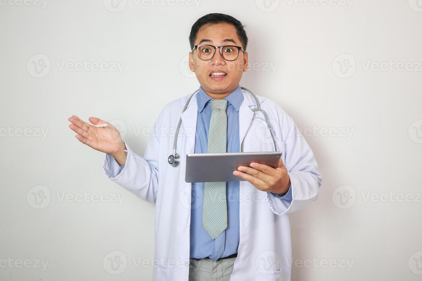 Asian male medical doctor hand out and showing copy space for your product, isolated on white background. photo
