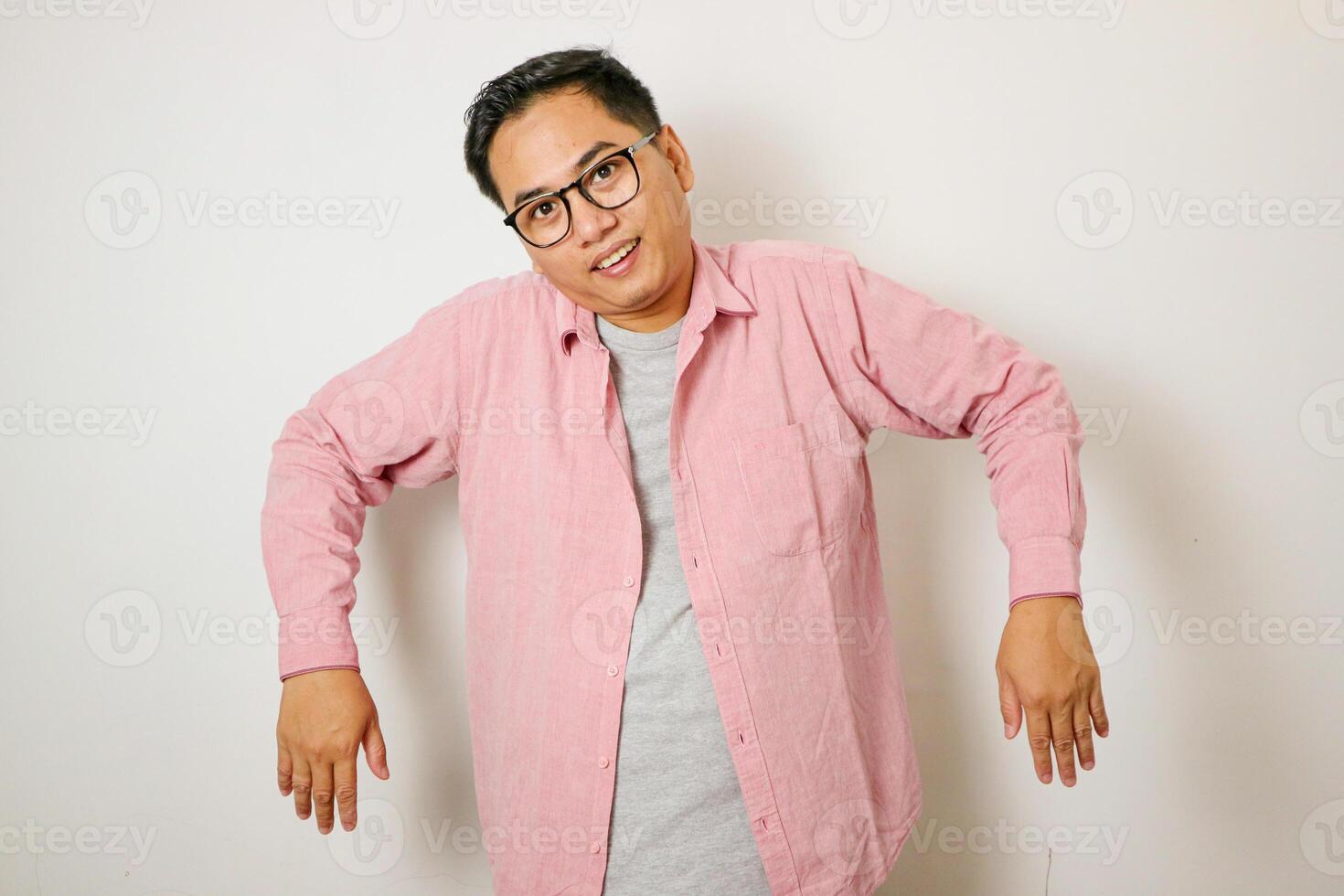 Asian man raises both hands and shoulders because he is lazy photo