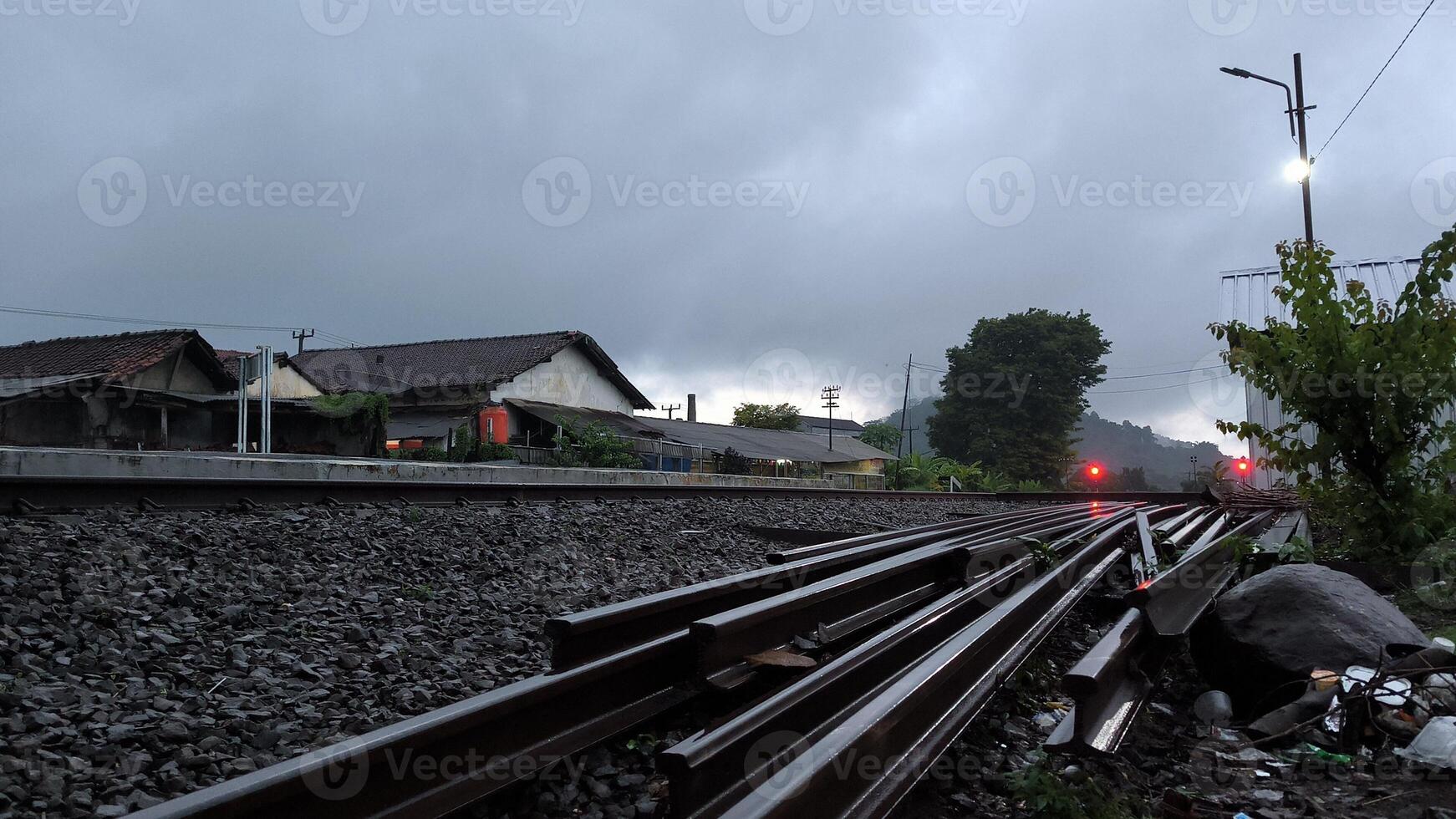 Railbed in station with rain photo