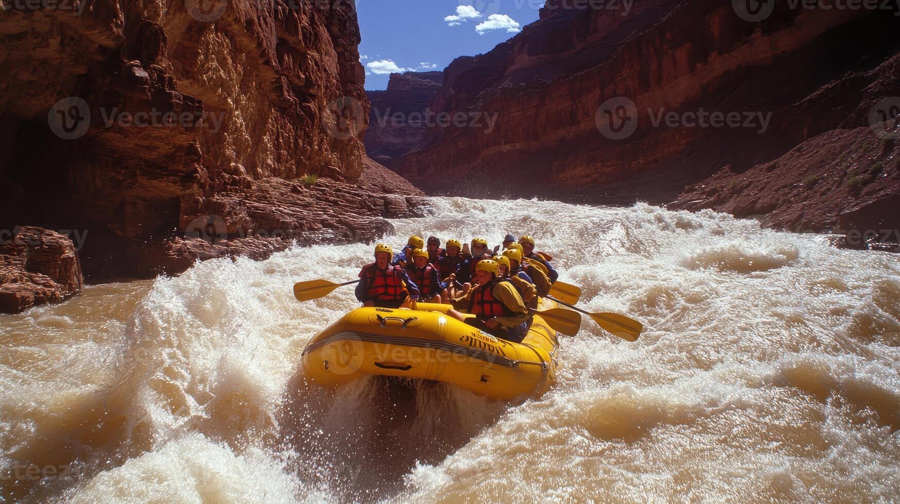 A group of people rafting on a river in a canyon, navigating through turbulent waters. photo