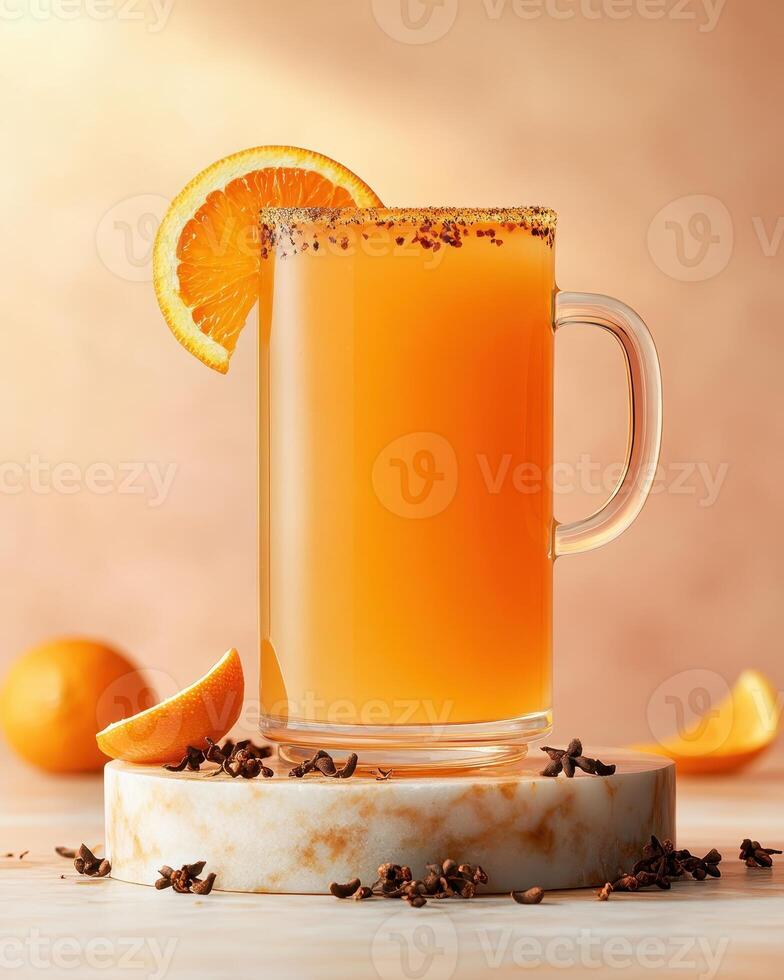A refreshing orange beverage garnished with a slice and spices, served in a glass mug. photo