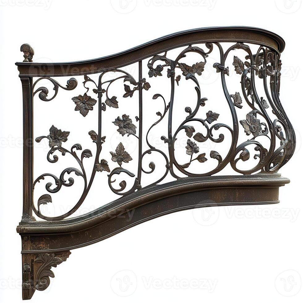 Ornate wrought iron balcony railing featuring floral designs and curves. photo