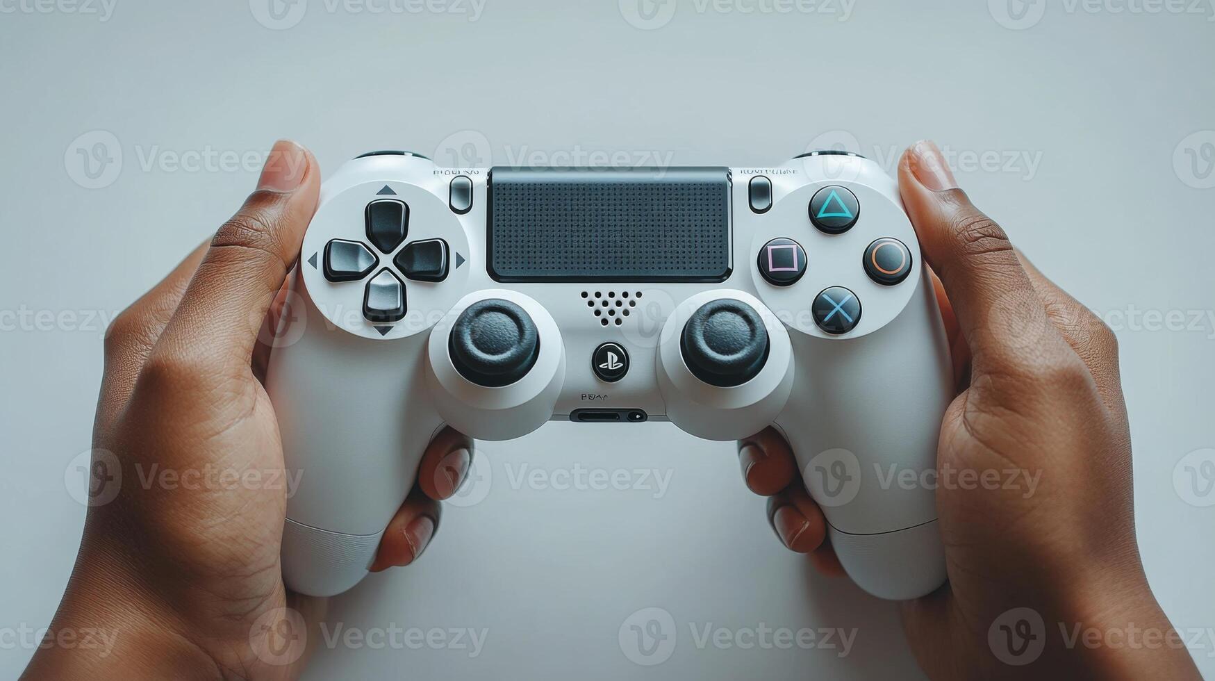 A person holding a white game controller photo