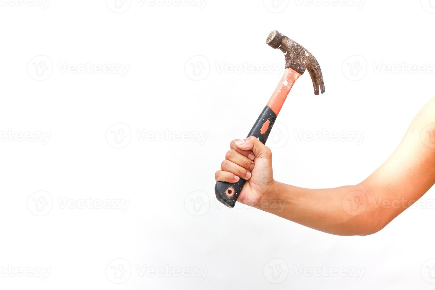 Strong arm wielding rusty hammer, demonstrating hand tool usage on white background photo
