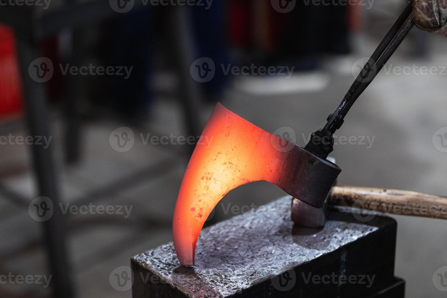 Artisan forging metal axe photo