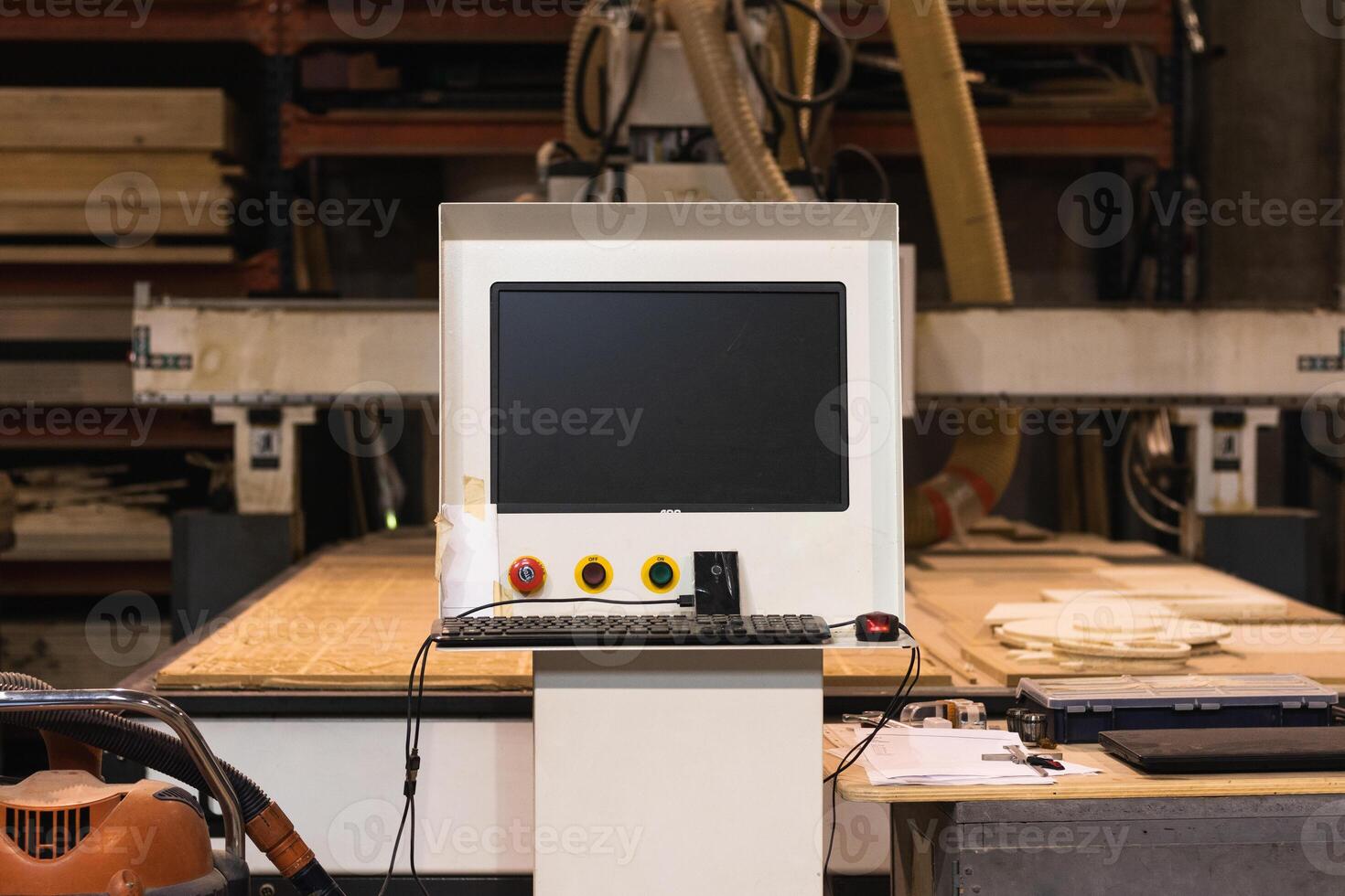 Computer numerical control of machine in workshop photo