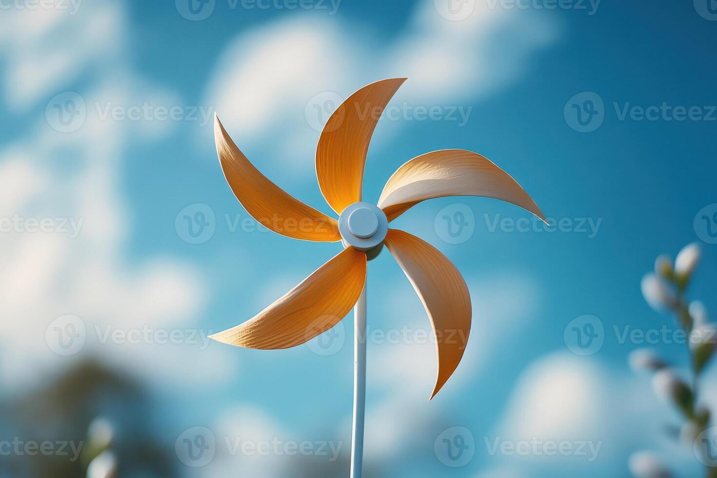 A windmill with a yellow and white propeller photo