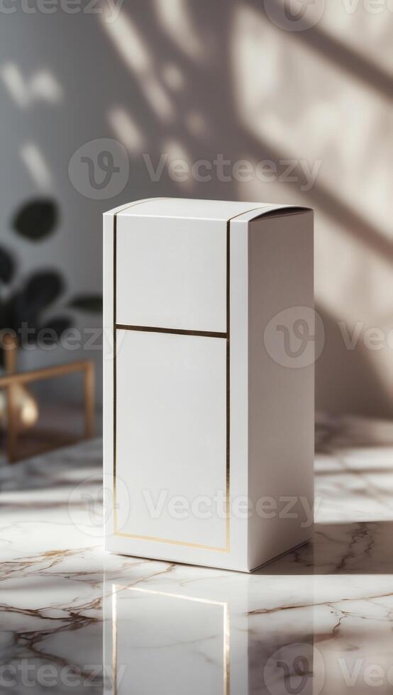 Elegant white box with gold trim standing on a luxurious marble surface, bathed in soft natural light and shadowed foliage. photo