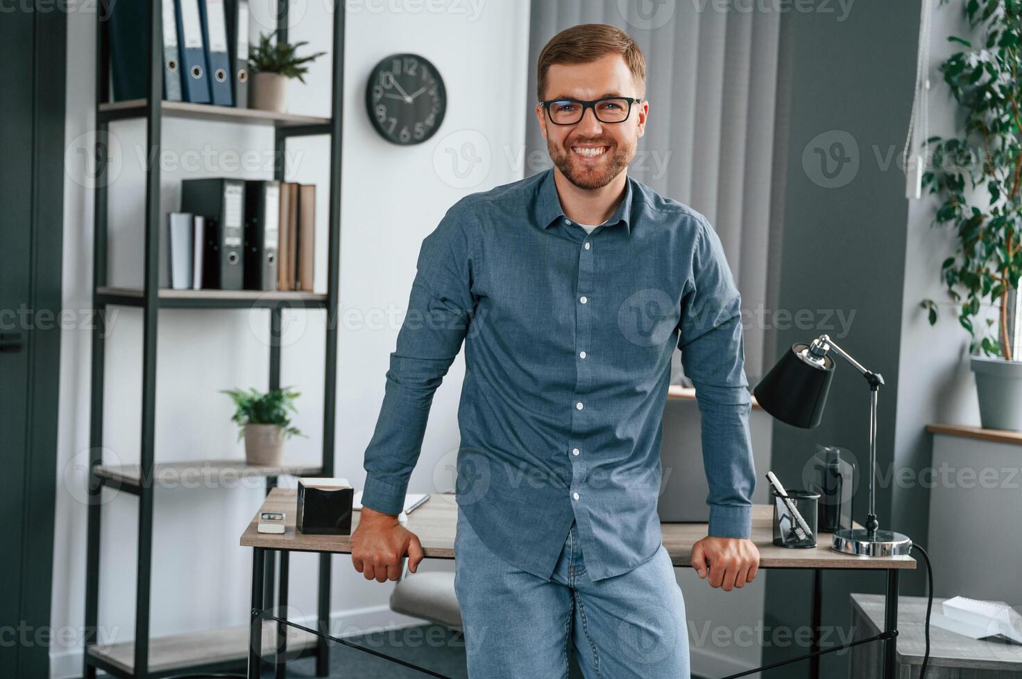 Man, is working in the modern office. Conception of business and freelance photo