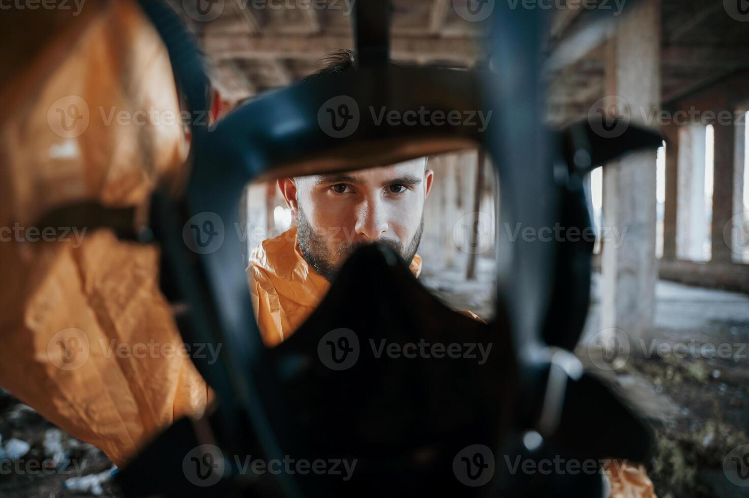 View through the respirator.. Man dressed in chemical protection suit in the ruins of the post apocalyptic building photo