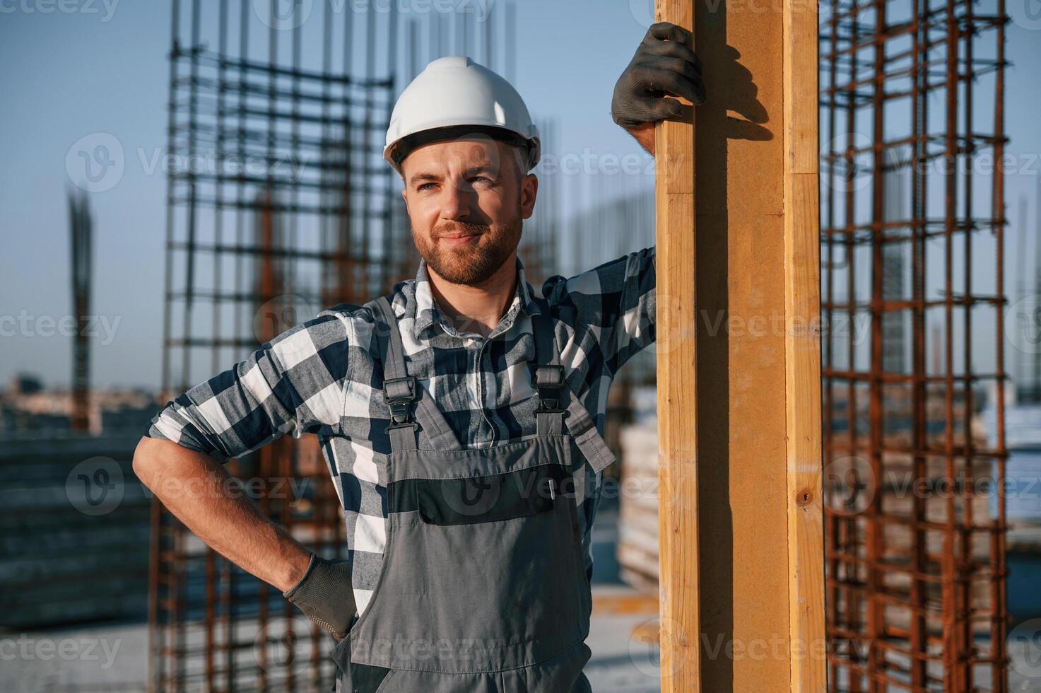 Confident worker. Man is on the construction ,site at daytime photo