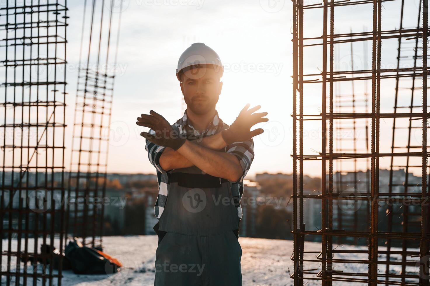 Restricted,, area. No trespassing. Man is working on the construction site at daytime photo