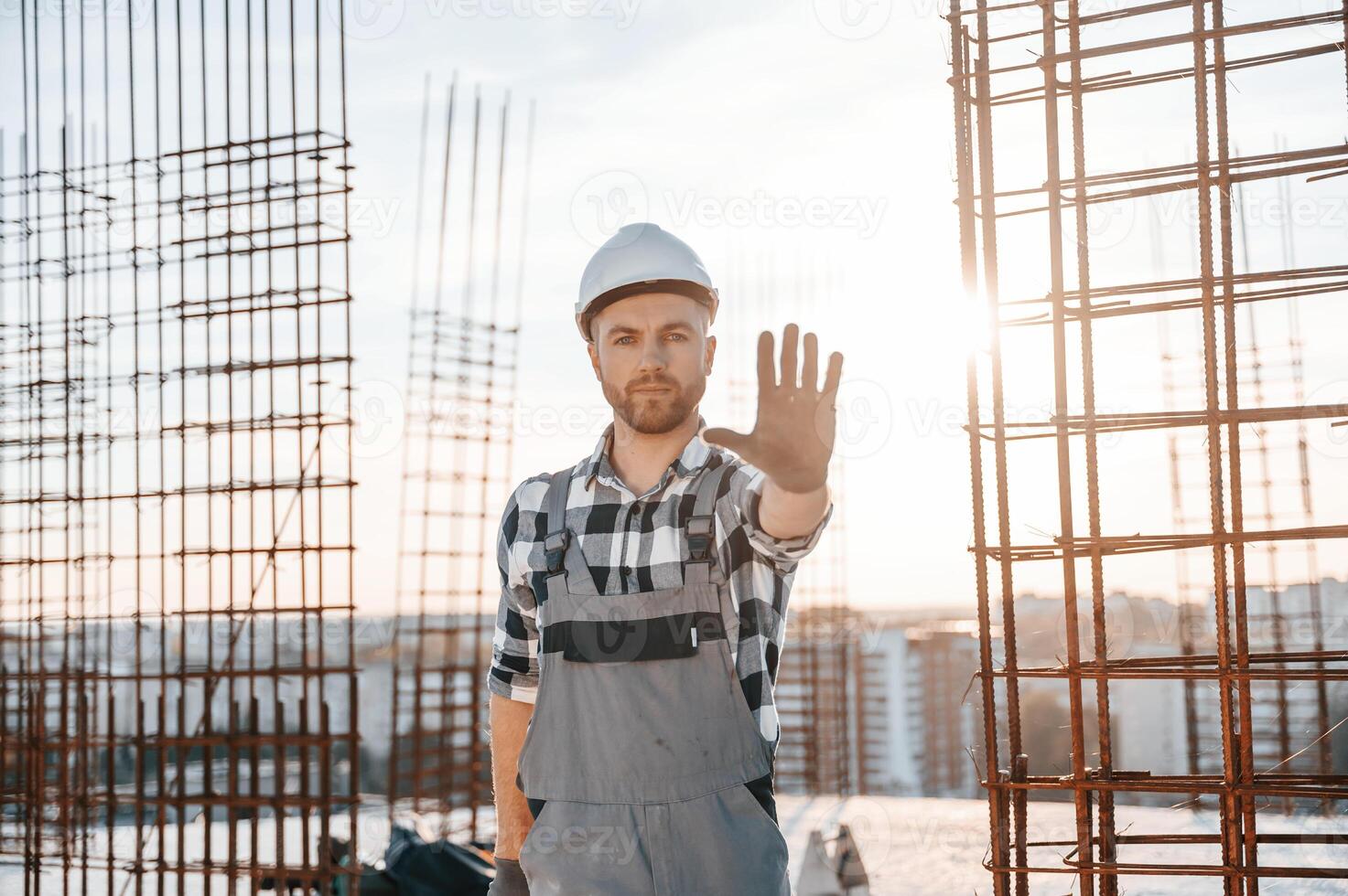 Restricted area. No trespassing. Man is working on the construction site at daytime photo