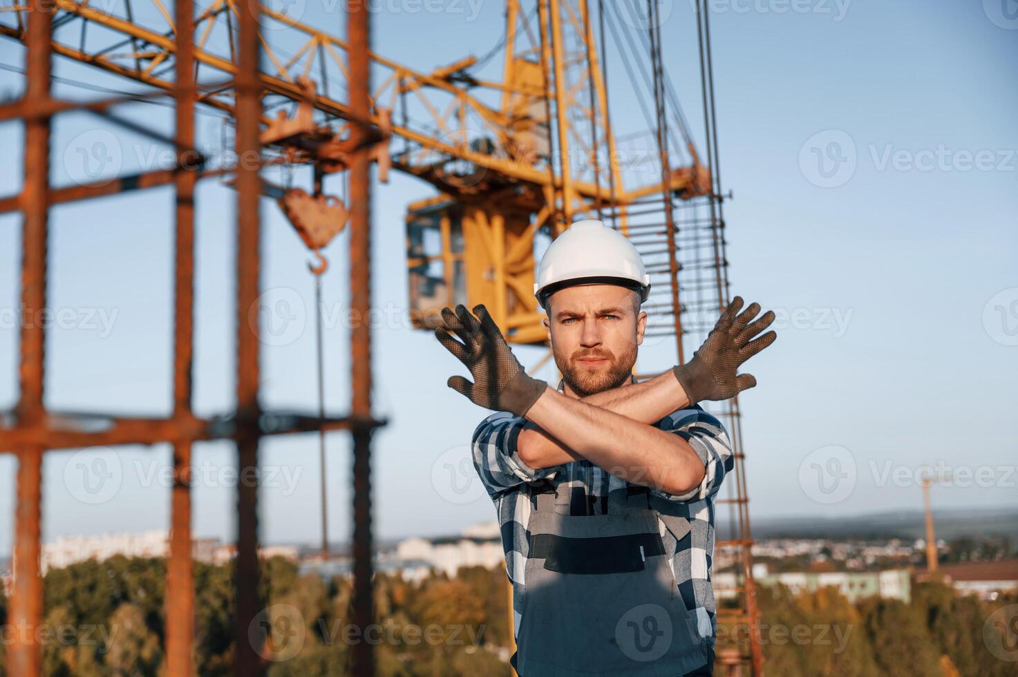 Restricted ,area. No trespassing. Man is working on the construction site at daytime photo