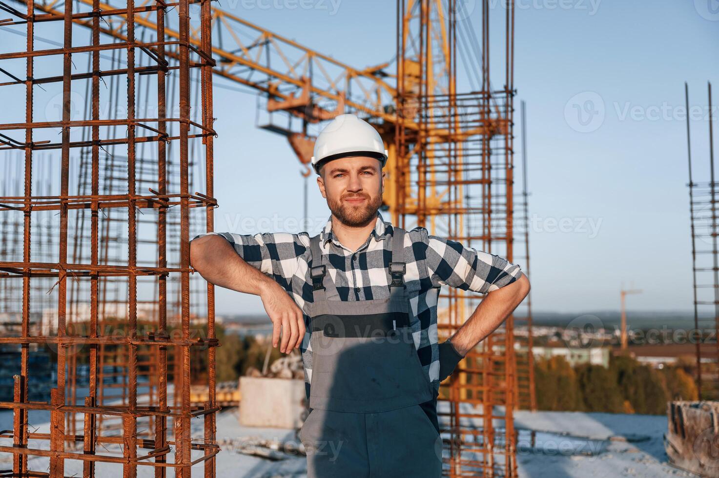 Front view of man that is working on the construction site at .daytime photo