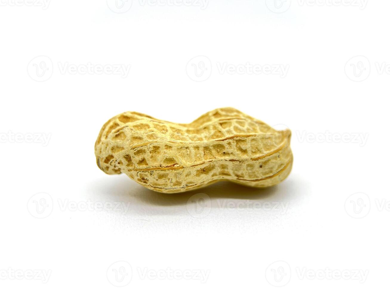 A peanut still inside their shell, beautifully arranged on a white background for a clean and simple presentation photo