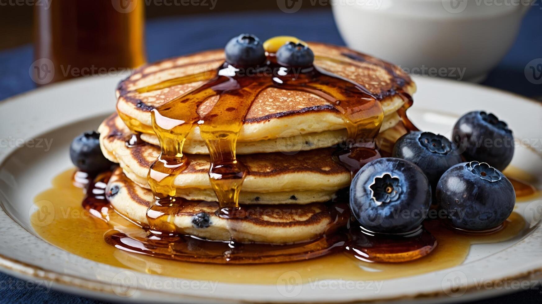 Delicious Stack of Blueberry Pancakes with Dripping Maple Syrup Close-Up photo
