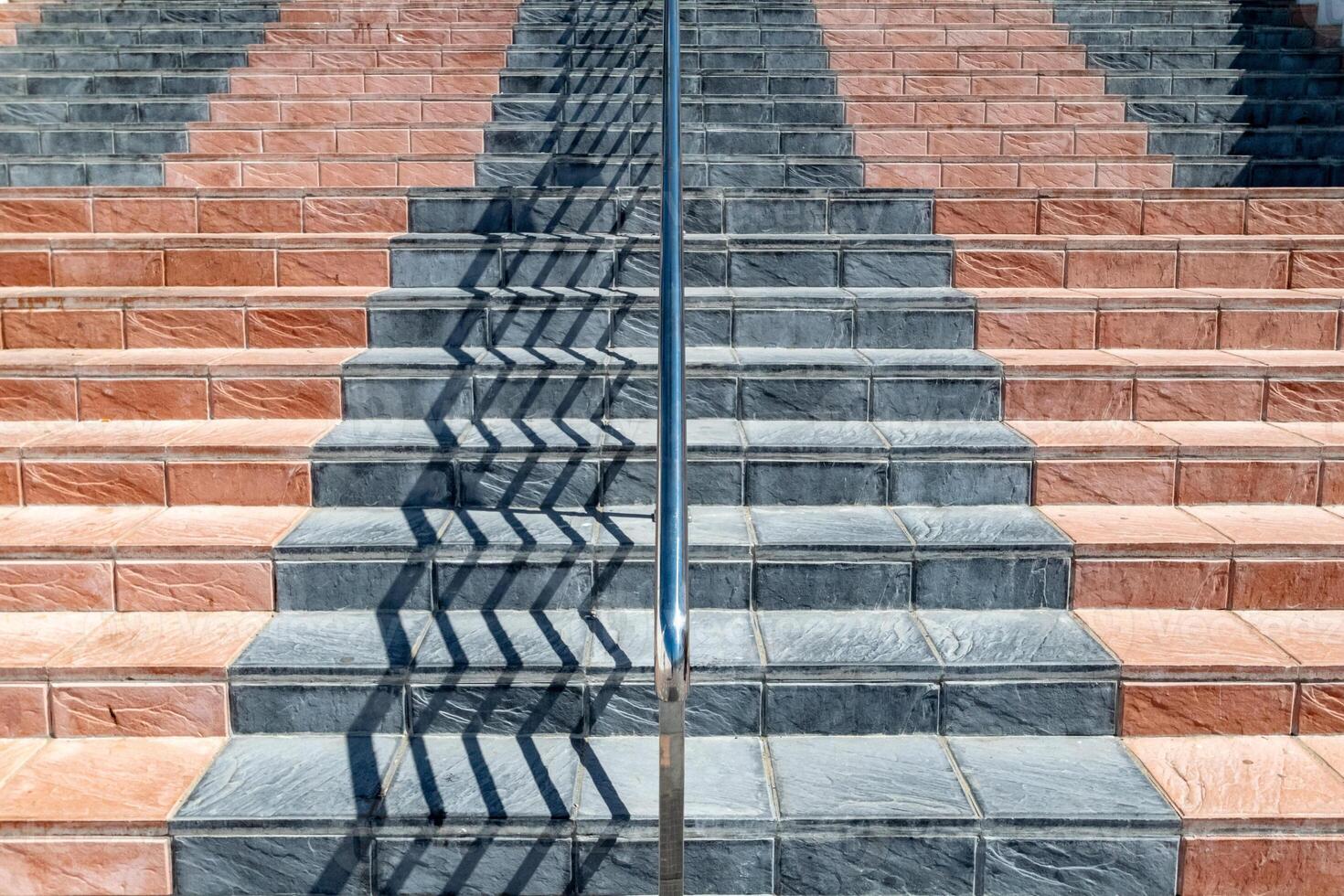 an abstract image of a staircase covered in coloured flint tiles photo