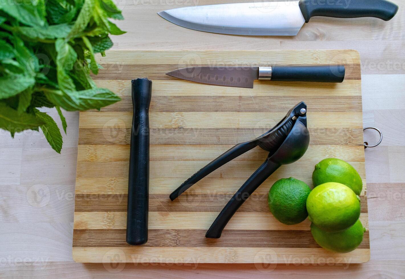 an image of ingredients and utensils for preparing a mojito cocktail photo