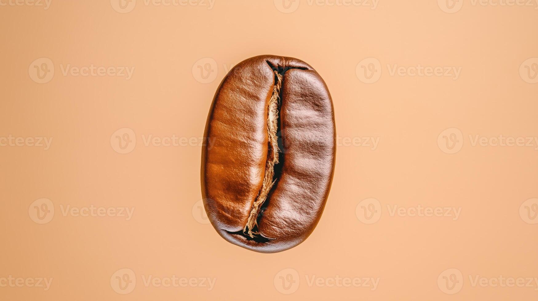 Roasted coffee bean hovers slightly above brown surface, with copy space photo
