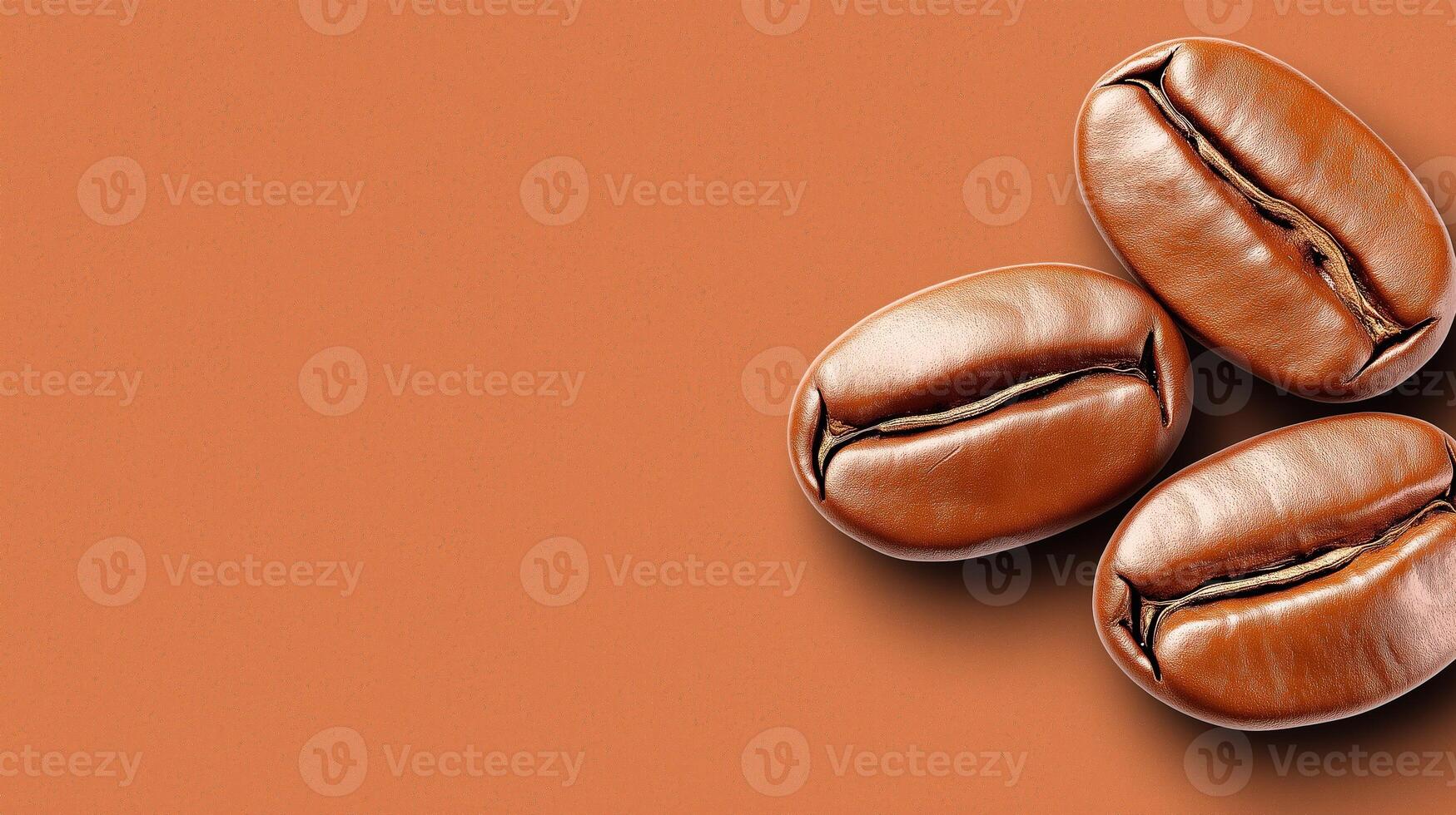 Three glossy, roasted coffee beans arranged on warm, textured brown surface, with copy space photo