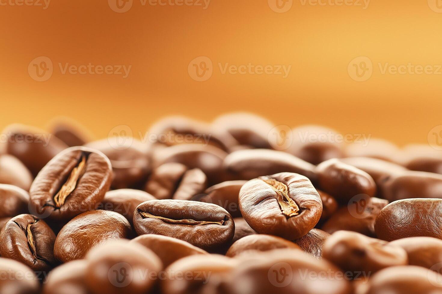 Roasted coffee beans creating textured background with warm orange gradient, with copy space photo