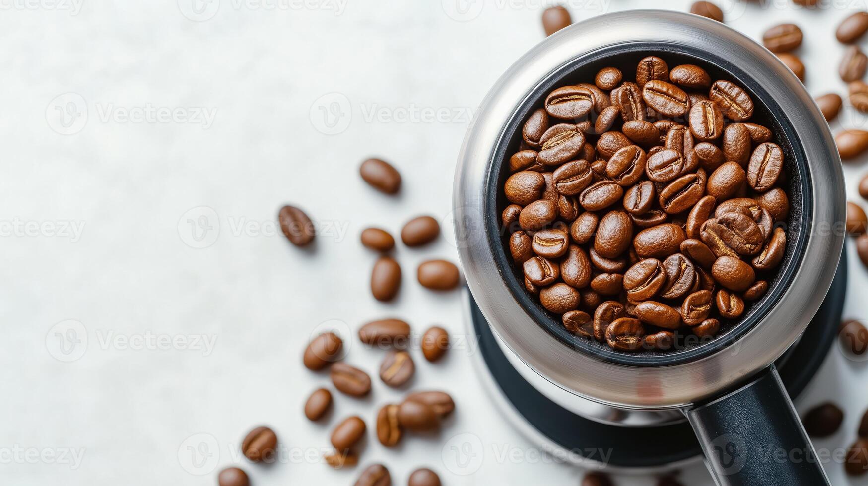 Roasted coffee beans in modern electric grinder, ready for brewing, with copy space photo