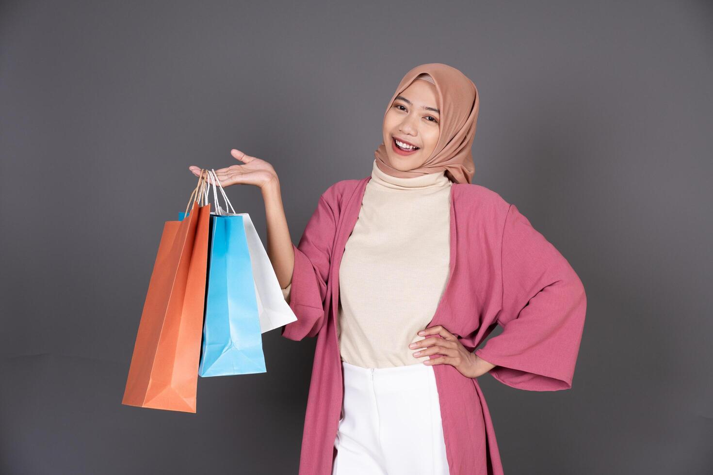 Hijab Girl Carrying a Shopping Bag photo