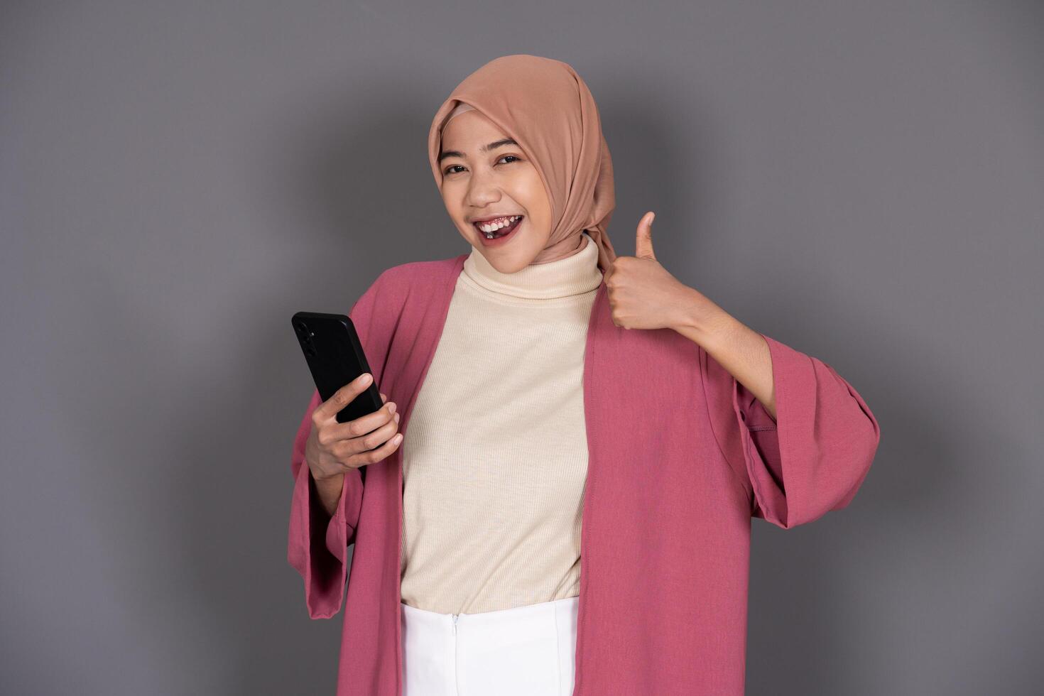 Hijab Woman with Phone Background photo