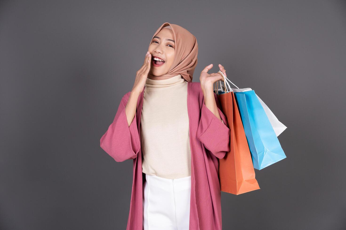 Hijab Female Carrying a Shopping Bag Background photo