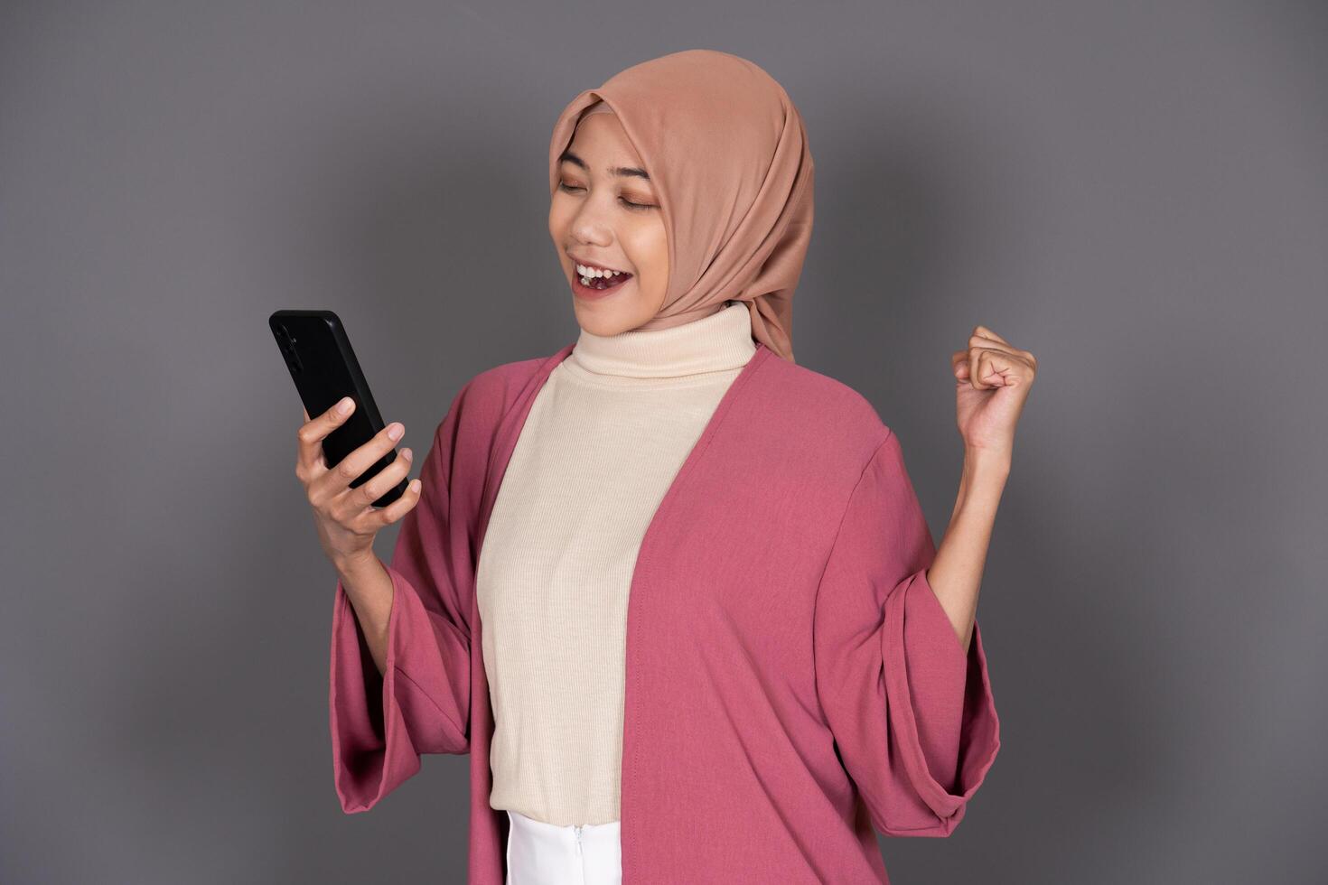Hijab Woman with Phone Isolated Background photo