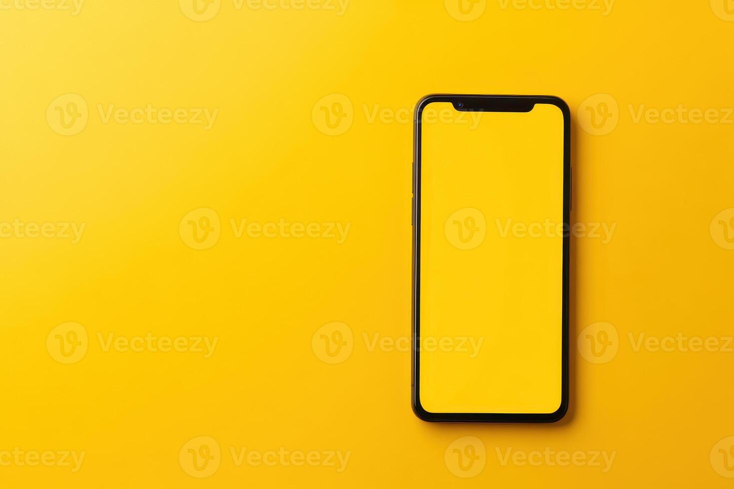 Black Smartphone with Blank Screen on Yellow Background photo