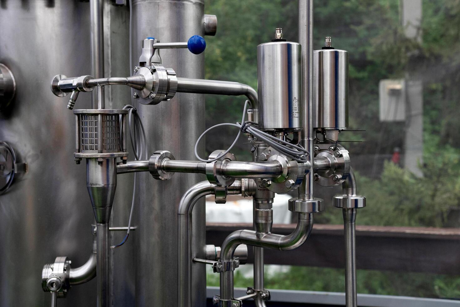 Equipment dairy plant, milk factory industry and processing tanks. photo