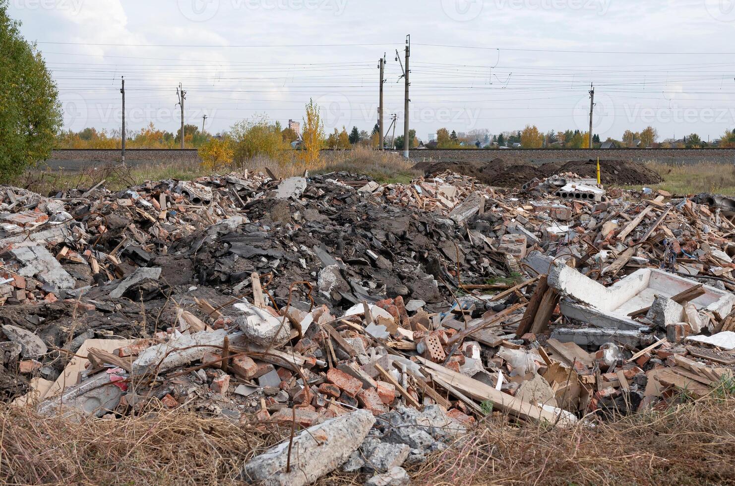 Construction waste. A pile of red broken bricks, concrete debris and rubble. Demolition rubble photo