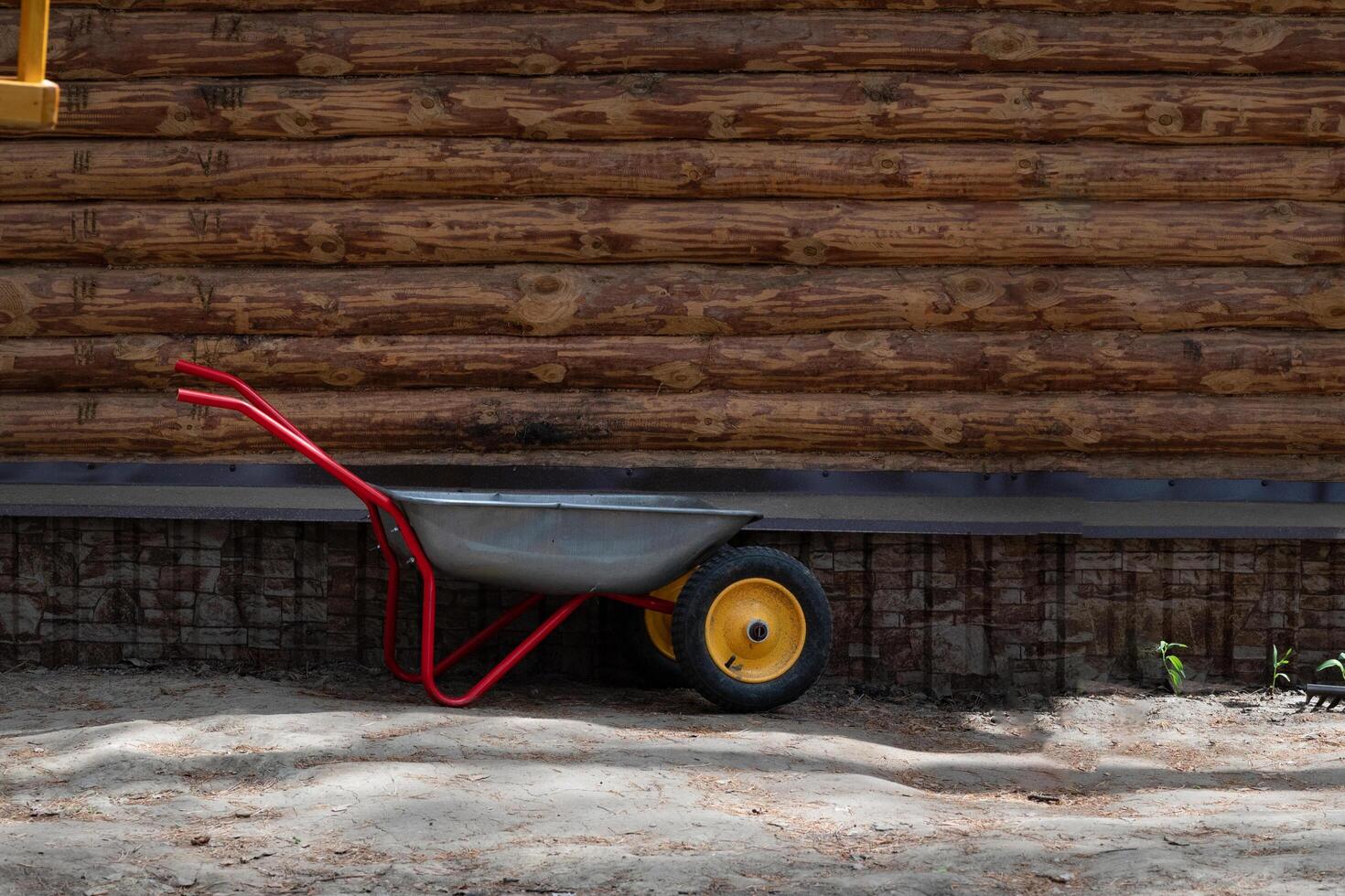 Metal wheelbarrow for trash, garbage, dry leaves. photo